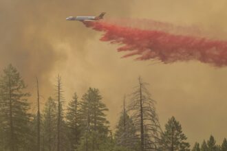 California firefighters make progress as wildfires push devastation and spread smoke across US West