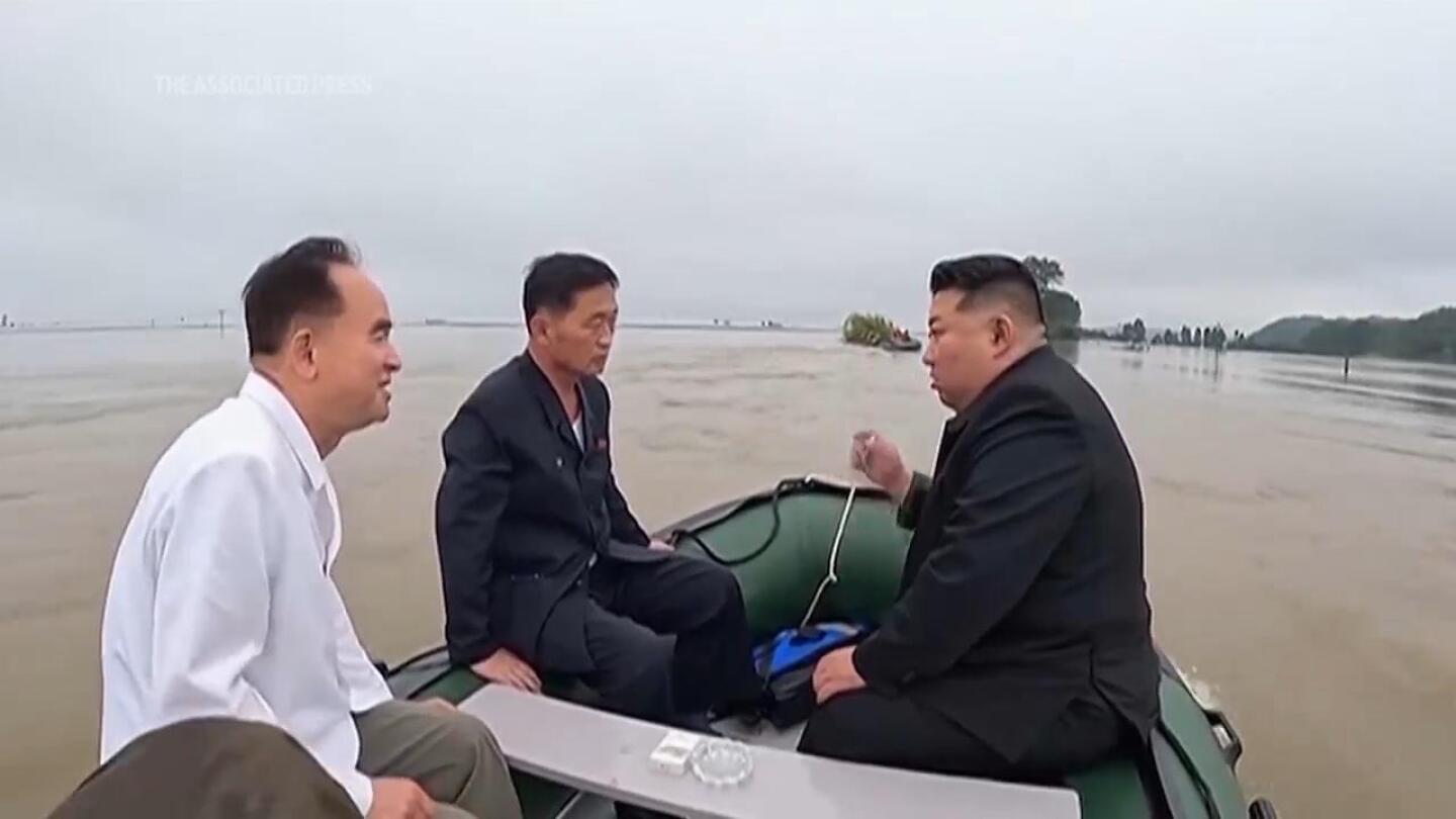 North Korea leader and senior officials board small boat to inspect impact of devastating floods