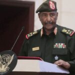 Sudan’s military says its top commander survived a drone strike that killed 5 at an army ceremony