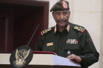 Sudan’s military says its top commander survived a drone strike that killed 5 at an army ceremony