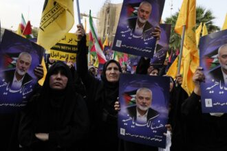 Iran’s supreme leader prays over the coffin of Hamas leader Haniyeh, whose killing risks a wider war