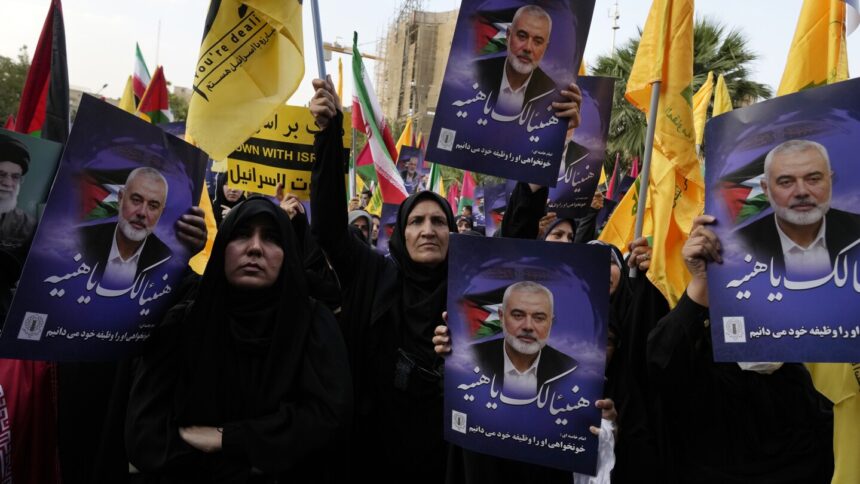 Iran’s supreme leader prays over the coffin of Hamas leader Haniyeh, whose killing risks a wider war