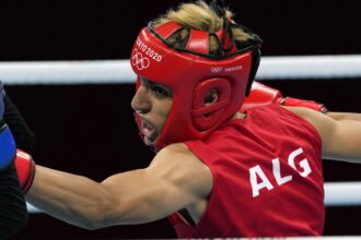 Algeria boxer who had gender test issue wins first Olympic fight in Paris when opponent quits