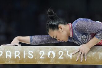 Sunisa Lee’s long road back to the Olympics ended in a familiar spot: the medal stand