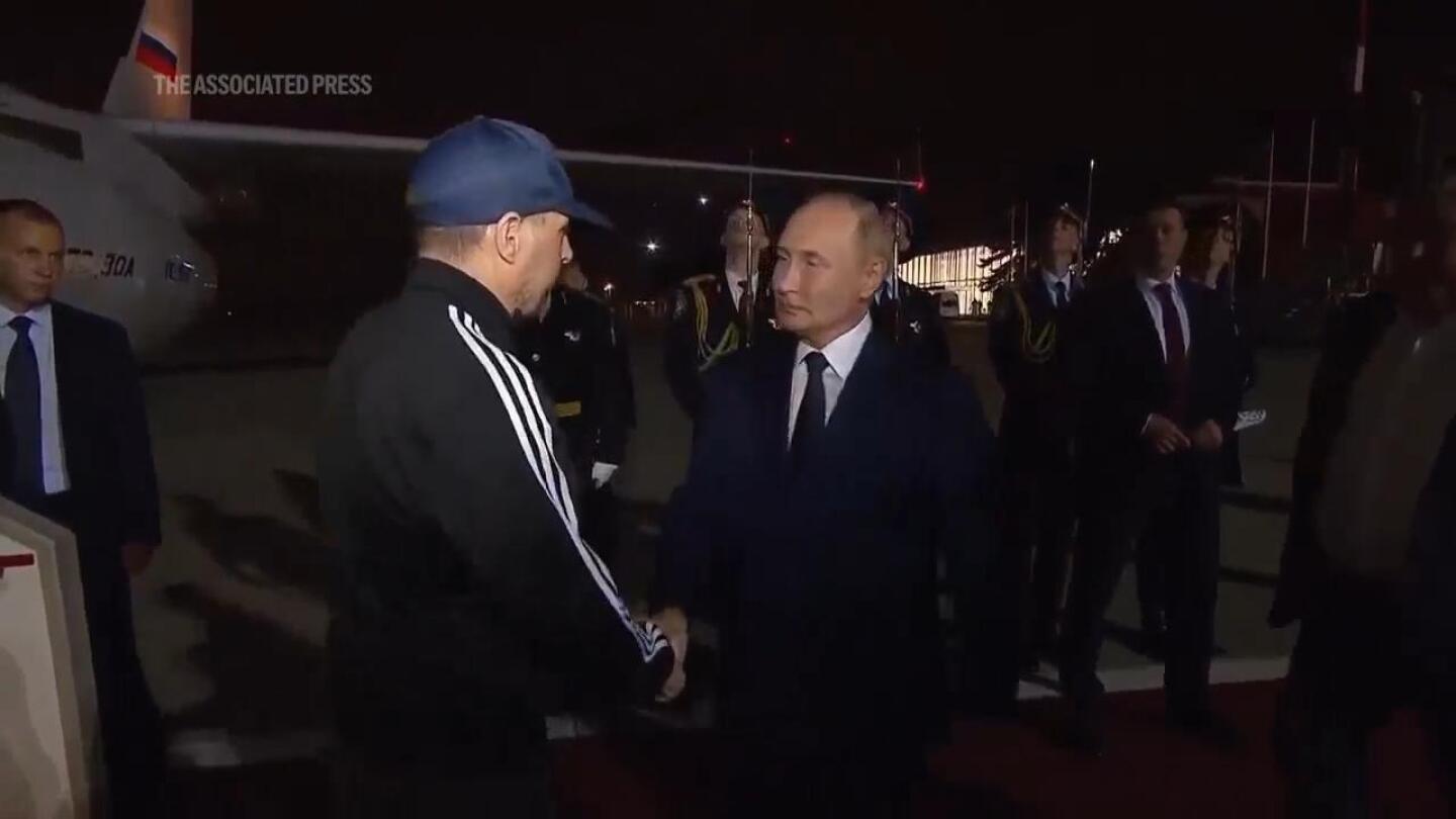 Putin greets prisoners freed in swap with US as they arrive in Moscow