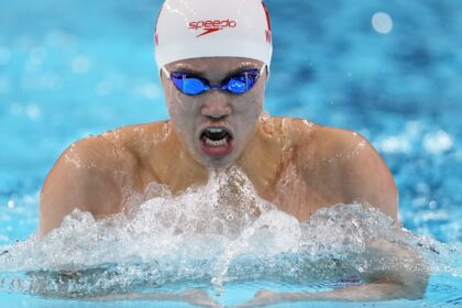 Another Chinese Olympic swimming medalist linked to doping scandal denies any wrongdoing