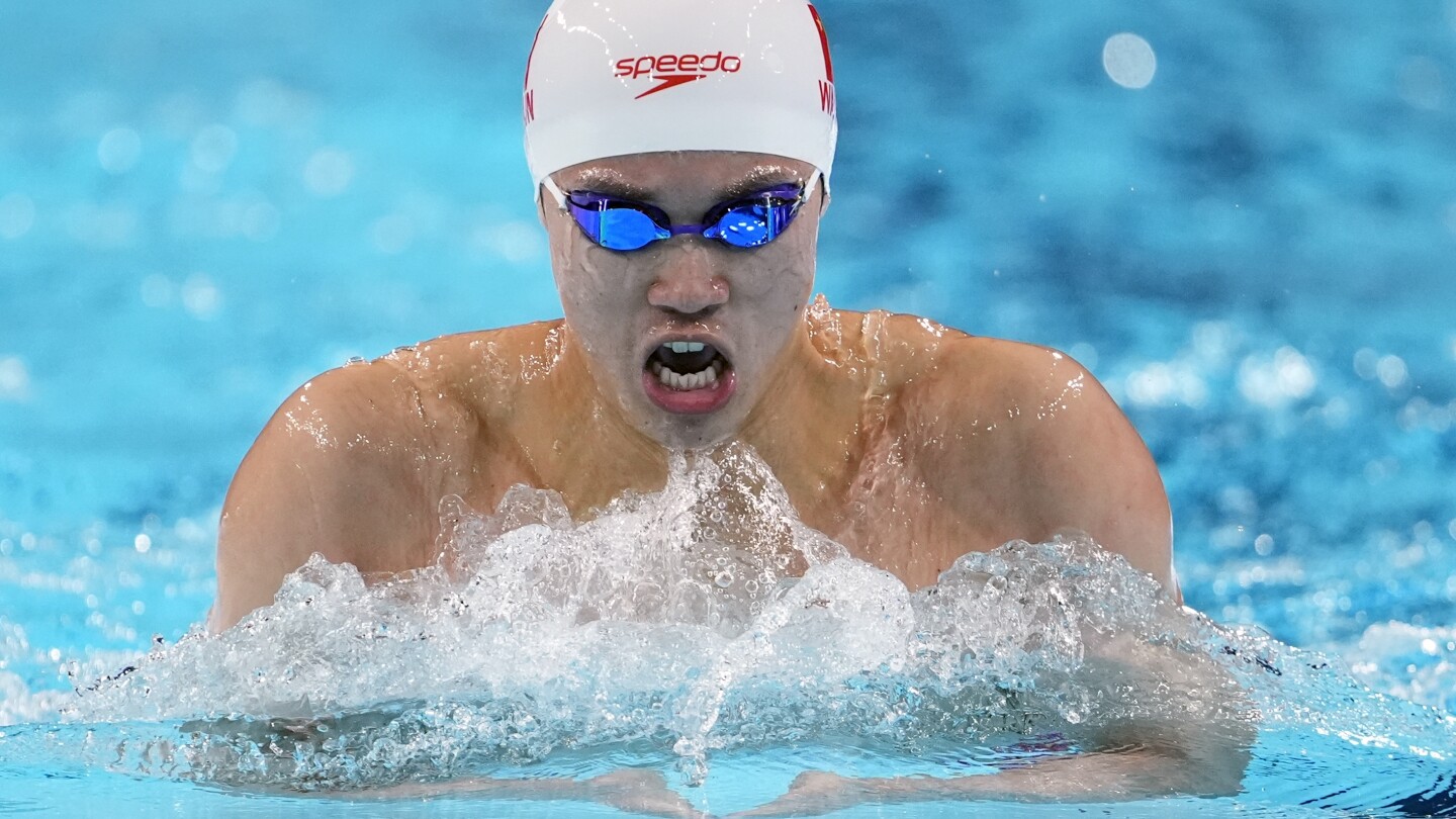 Another Chinese Olympic swimming medalist linked to doping scandal denies any wrongdoing