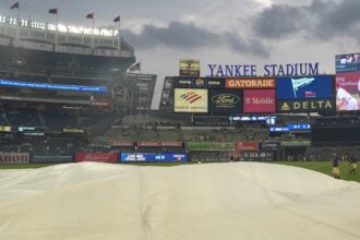 Some Yankee Stadium bleachers fans chant `U-S-A!’ during `O Canada’ before game against Blue Jays