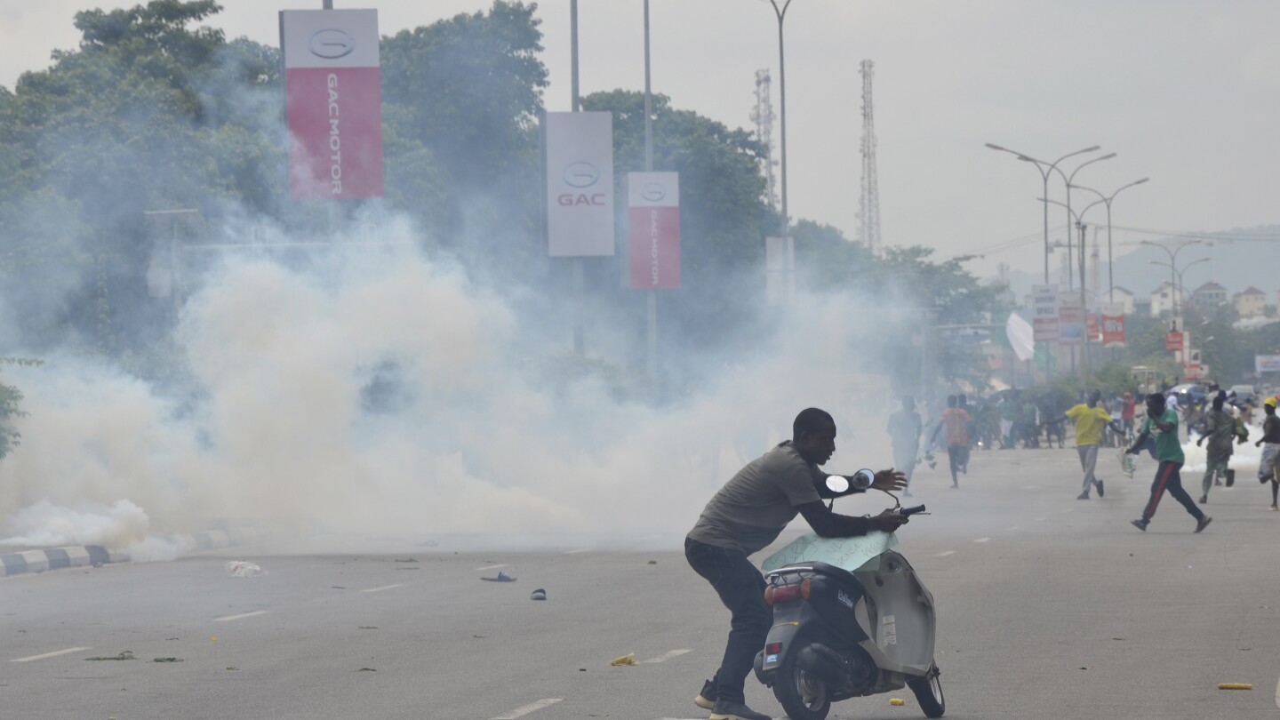 Nigerian leader calls for end to hardship protests, blaming ‘political agenda’ for violence