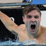 American Bobby Finke sets 1,500 freestyle world record on final night of Olympic swimming