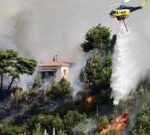 Greece wildfire forces residents to flee as heatwave persists