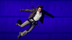 Tom Cruise abseils off stadium roof in daring Olympic finale