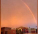 Minnesota:  Lightning strikes and a rainbow forms during storm