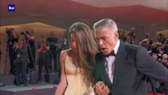 Clooney helps fallen photographer at Venice Film Festival