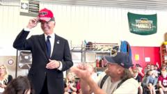 Watch: Moment Biden puts on red Trump 2024 hat