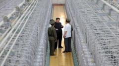 North Korea releases rare photos of Kim in nuclear facility