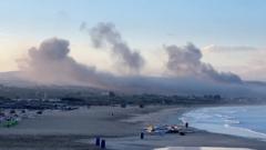 Smoke from several Israeli strikes seen from Lebanon beach