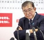 Japan PM vows to continue ruling despite bruising loss