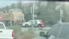 Children saved from car stuck in path of oncoming train