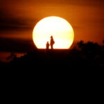 People enjoy the sunset in Vlora