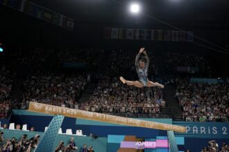 One Extraordinary (Olympic) Photo: Charlie Riedel captures Simone Biles in flight at the Paris Games