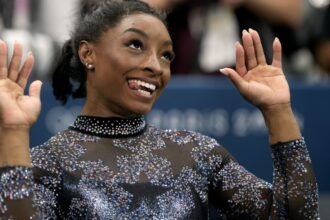 Biles and Team USA mix glamour and grit to surge to the lead at Olympic gymnastics qualifying