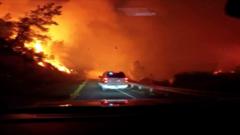 Vehicle drives through intense wildfire in California