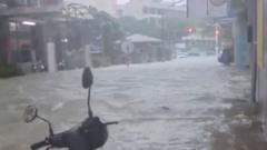 Watch: People rescued as Typhoon floods shops and streets