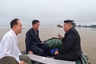 North Korea leader and senior officials board small boat to inspect impact of devastating floods