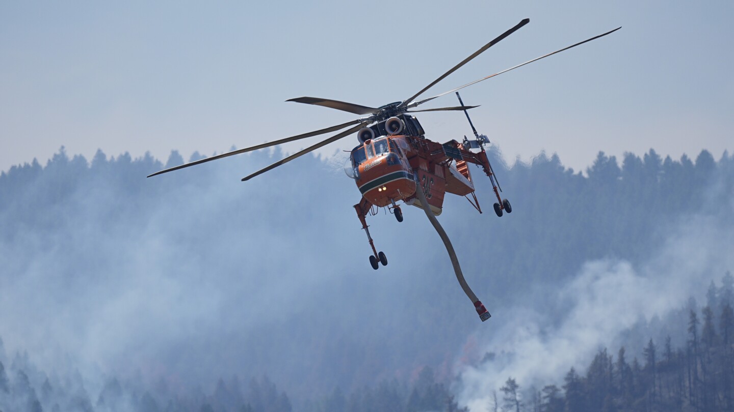 Wildfires encroach on homes near Denver as firefighters face sweltering heat