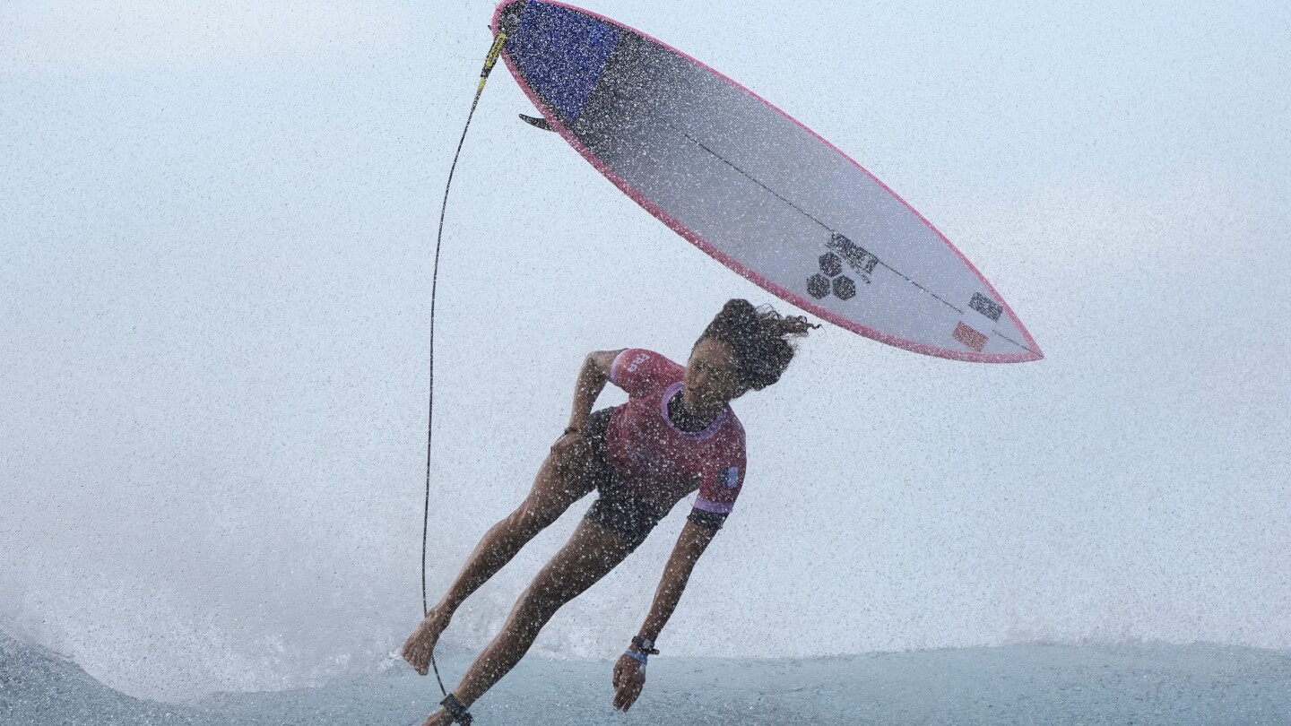 One Extraordinary (Olympic) Photo: Gregory Bull captures surfer battling waves in Tahiti