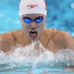 Another Chinese Olympic swimming medalist linked to doping scandal denies any wrongdoing