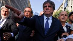 Carles Puigdemont: Police hunt ex-Catalan separatist leader after return from exile