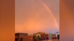 Minnesota:  Lightning strikes and a rainbow forms during storm