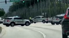 Police cars block traffic near Trump golf course