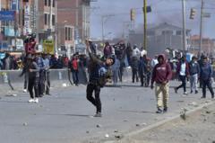 Street battles in Bolivia as Evo Morales leads march to capital