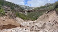 Train track left hanging in the air after Bosnia landslides