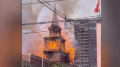 Tower falls as historic San Francisco Church destroyed by fire